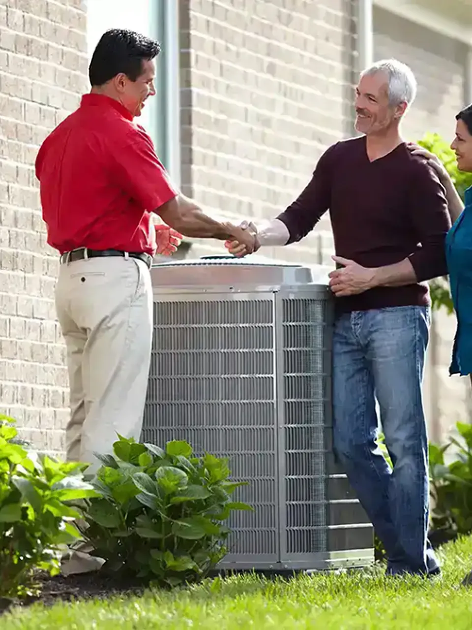 Sarasota AC service technician, shaking hands with a customer