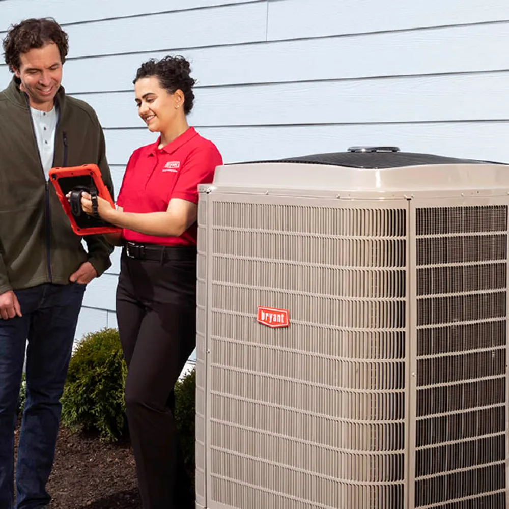 An HVAC service Sarasota technician explaining ac repair procedure to customer